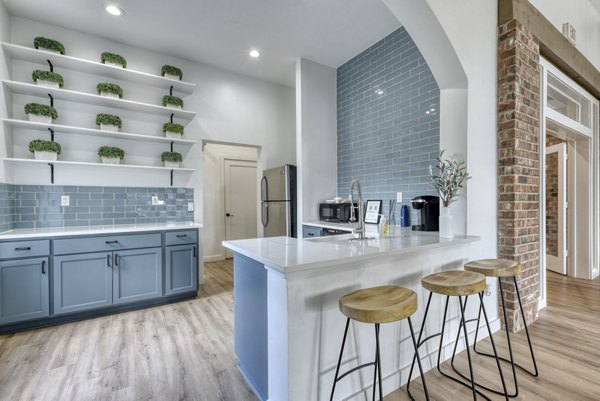 Modern kitchen with stainless steel appliances at The Jax Apartments