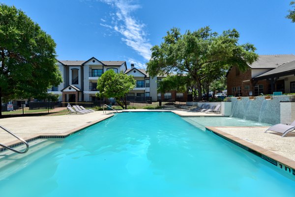 Rooftop pool with city views at The Jax Apartments