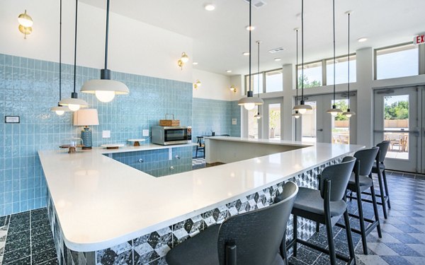 Clubhouse featuring modern design and vibrant decor at Jovie Pflugerville Apartments