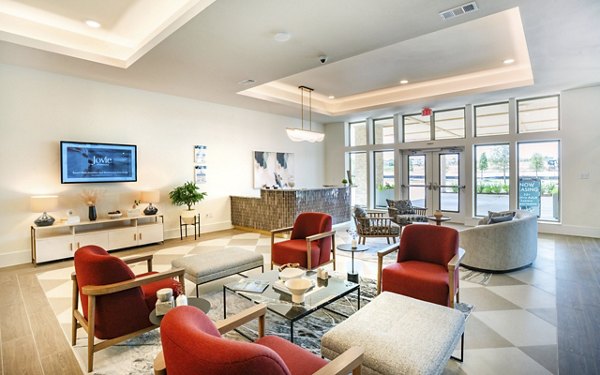 Clubhouse featuring modern design at Jovie Pflugerville Apartments, perfect for gatherings and community events