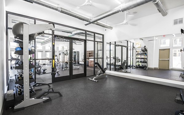 Well-equipped fitness center at Jovie Pflugerville Apartments featuring modern exercise machines for a complete workout experience