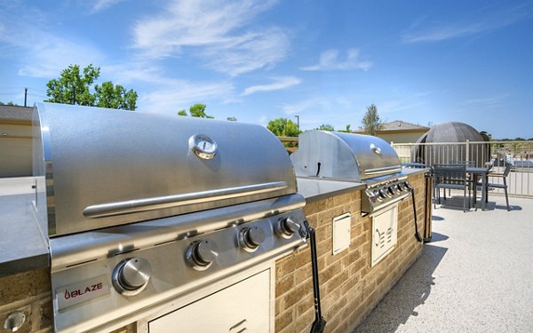 Outdoor grill area with modern design at Jovie Pflugerville Apartments