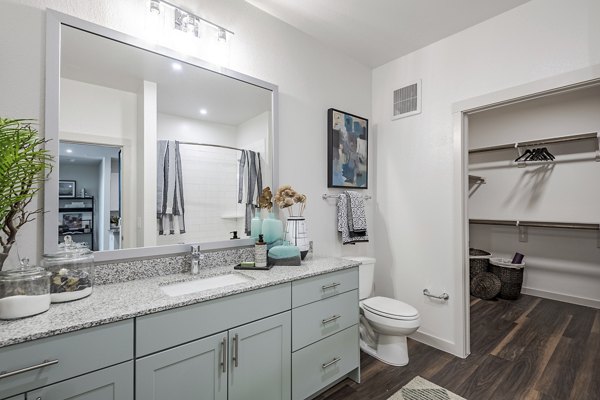 Bathroom featuring modern fixtures and elegant tilework at Prose Greenbriar Apartments