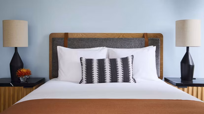 Cozy bedroom with stylish decor at CHROMA Apartments