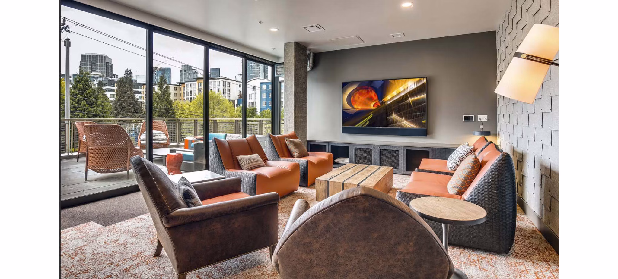 Clubhouse with modern decor featuring seating areas and a game room at CHROMA Apartments