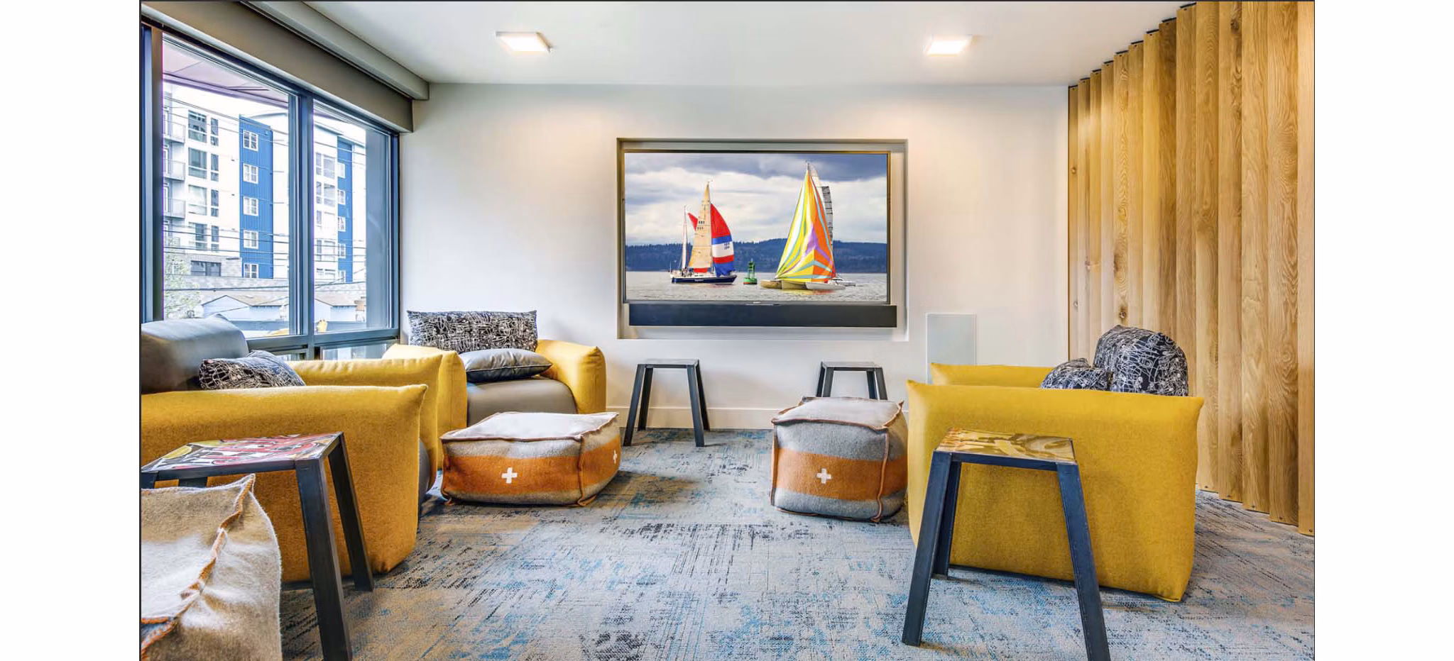 Chic clubhouse with modern design elements at CHROMA Apartments, creating a stylish space for residents to gather and relax