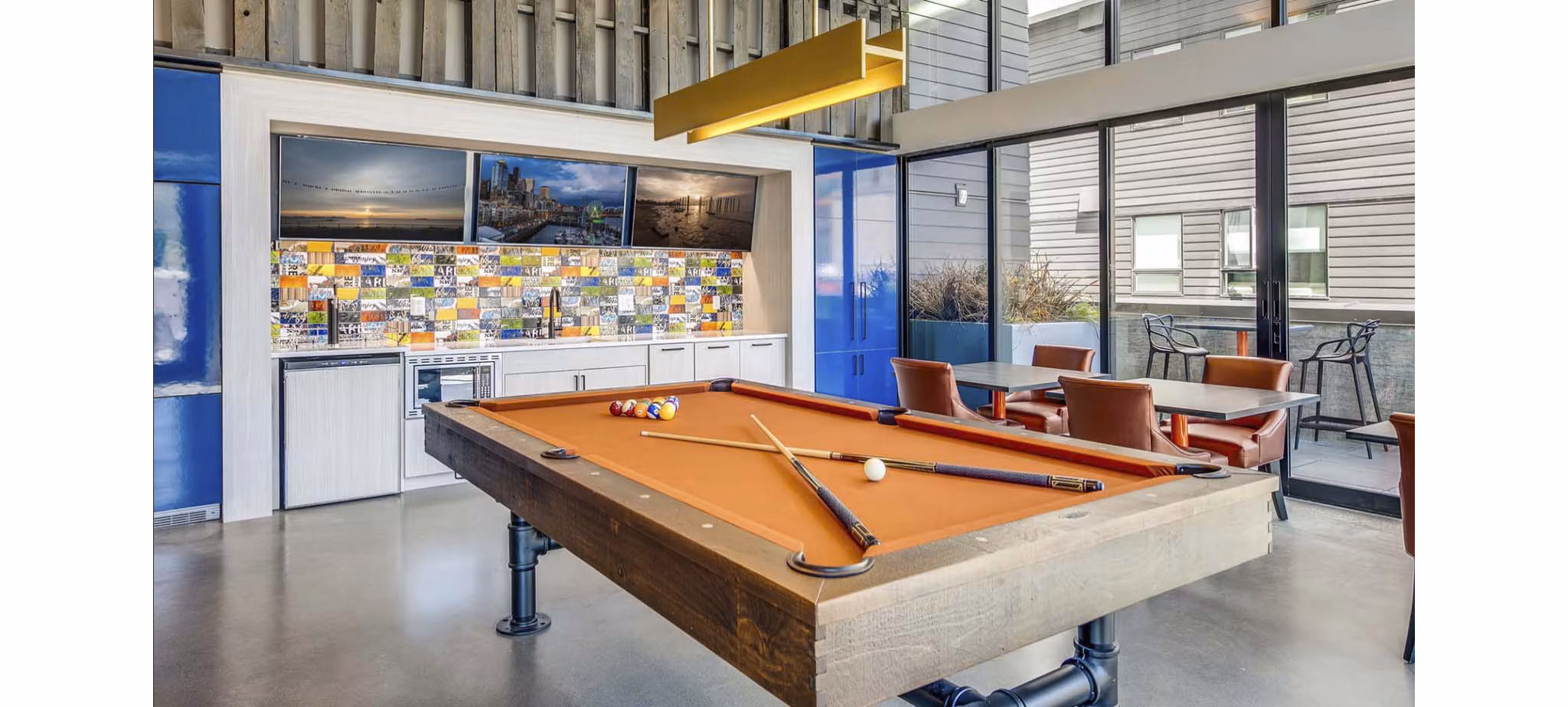 Clubhouse with modern decor at CHROMA Apartments, offering luxury amenities and vibrant communal spaces