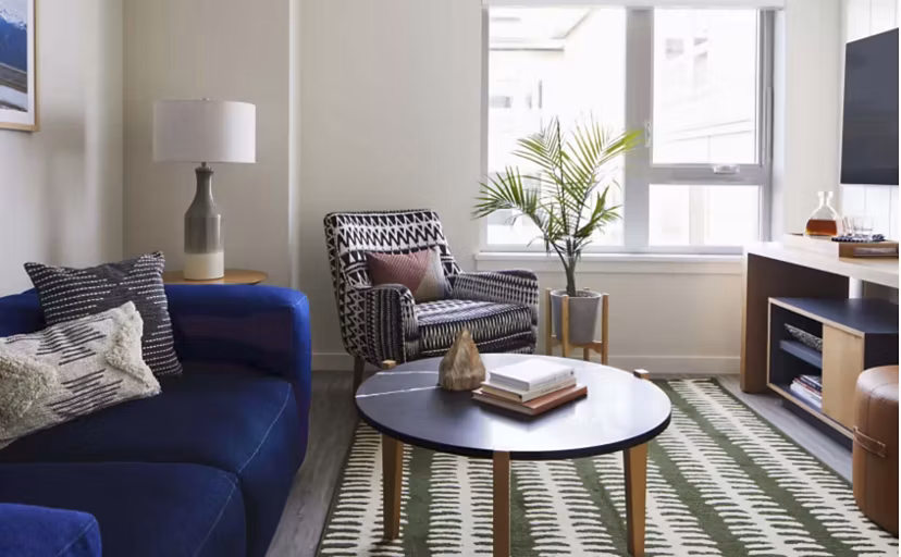 Contemporary living room with chic decor in CHROMA Apartments, offering elegant and comfortable luxury living spaces