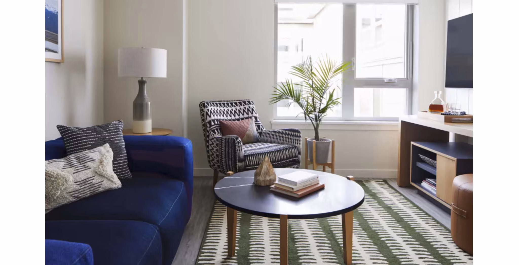 Contemporary living room with chic decor in CHROMA Apartments, offering elegant and comfortable luxury living spaces