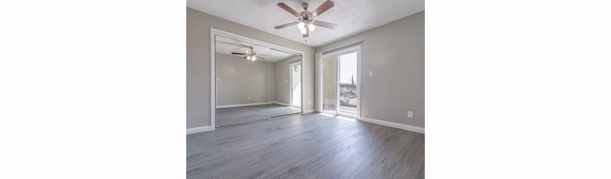 Cozy bedroom with modern decor and ample natural light at Citrus Court Apartments