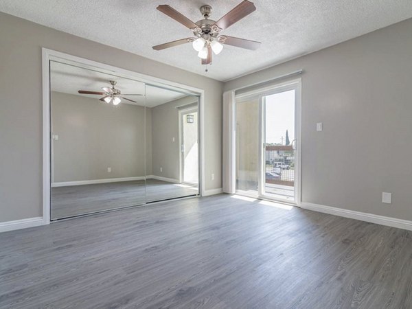 Cozy bedroom with modern decor and ample natural light at Citrus Court Apartments