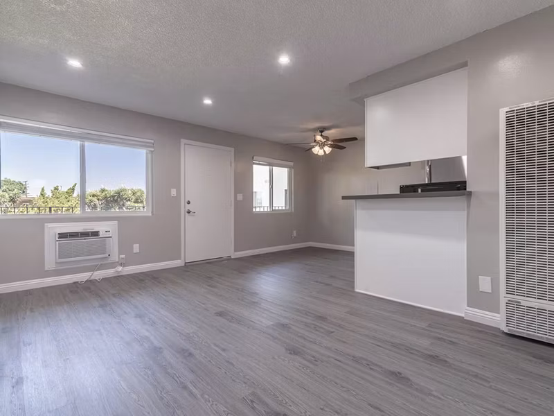 Modern living room with sleek furniture and natural light at Citrus Court Apartments
