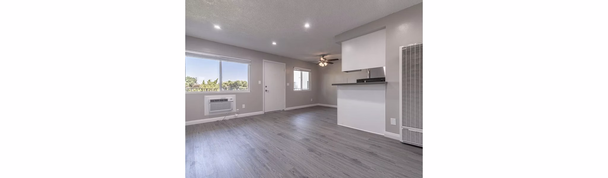 Modern living room with sleek furniture and natural light at Citrus Court Apartments