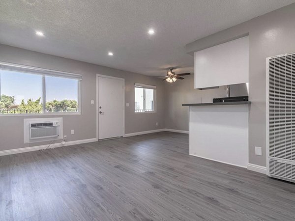 Modern living room with sleek furniture and natural light at Citrus Court Apartments