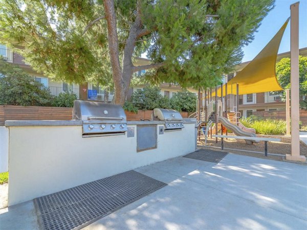 Outdoor patio with grilling stations at Citrus Court Apartments