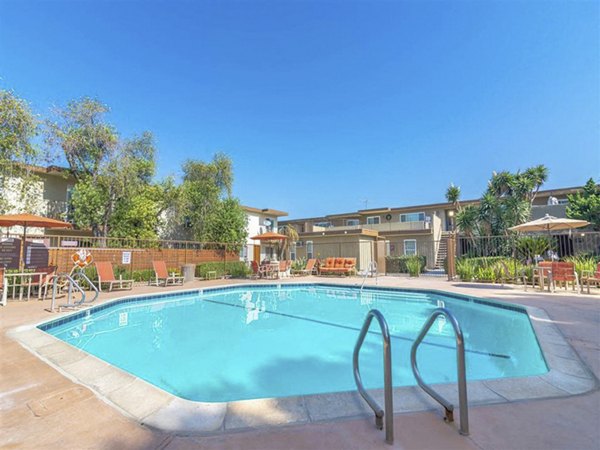 Citrus Court Apartments: Modern pool with resort-style loungers