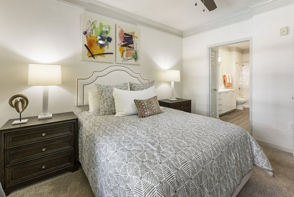 Tranquil bedroom with plush bedding and elegant decor at Gramercy at Buckhead Apartments