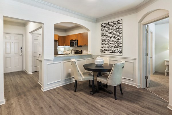 Dining room with elegant light fixtures and modern decor at Gramercy at Buckhead Apartments