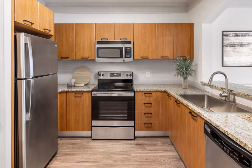 Modern kitchen with stainless steel appliances at Gramercy at Buckhead Apartments, offering luxury living in Atlanta
