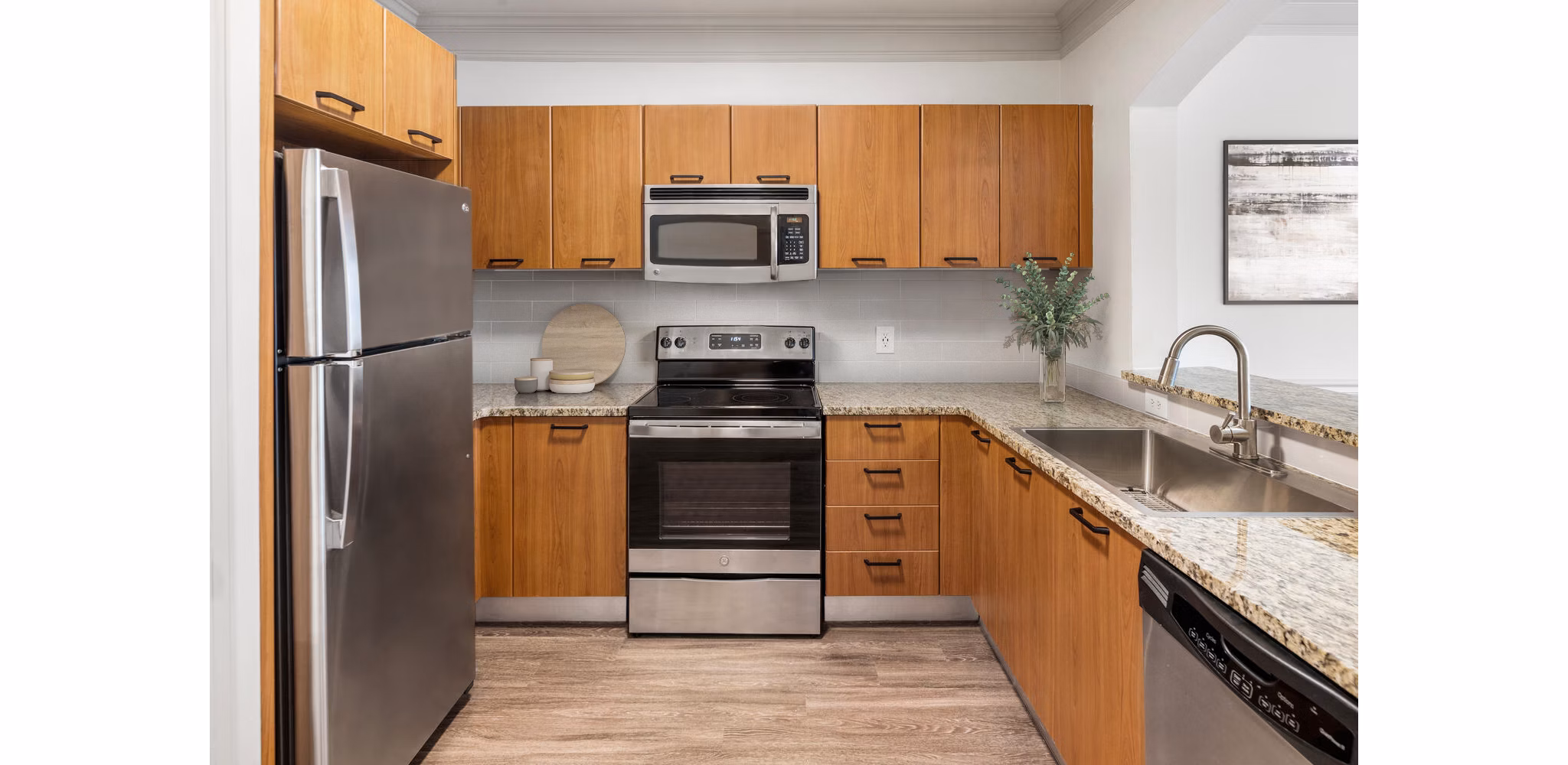 Modern kitchen with stainless steel appliances at Gramercy at Buckhead Apartments, offering luxury living in Atlanta