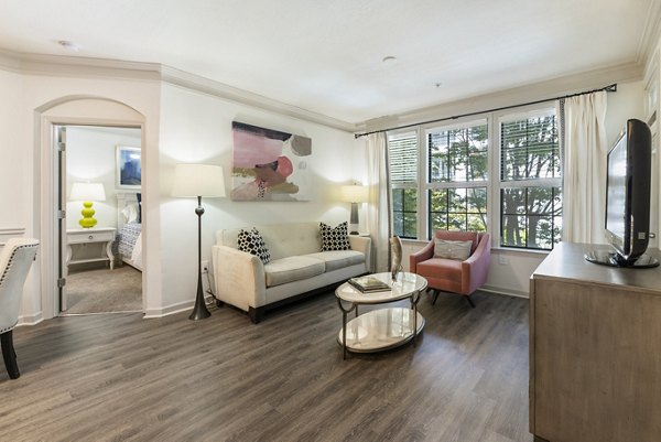 Living room featuring modern furniture and sleek design at Gramercy at Buckhead Apartments