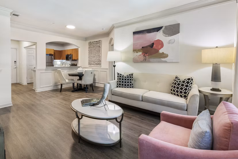 Spacious living room with modern decor and natural light at Gramercy at Buckhead Apartments