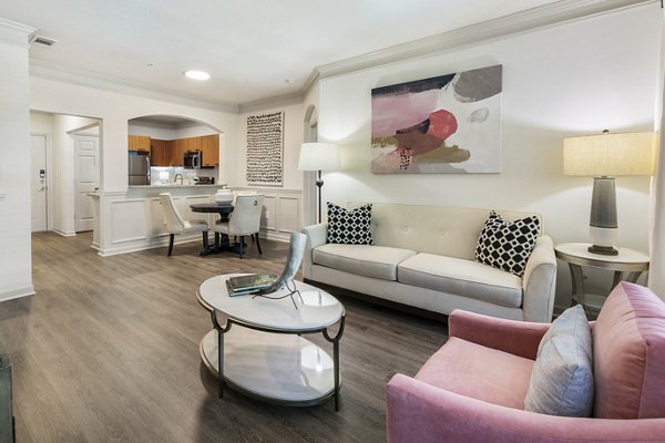 Spacious living room with modern decor and natural light at Gramercy at Buckhead Apartments