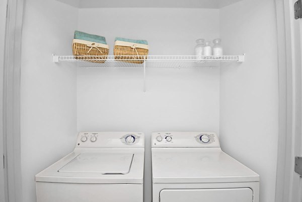 Laundry room with modern appliances at Gramercy at Buckhead Apartments, offering convenience and style in a premium rental community