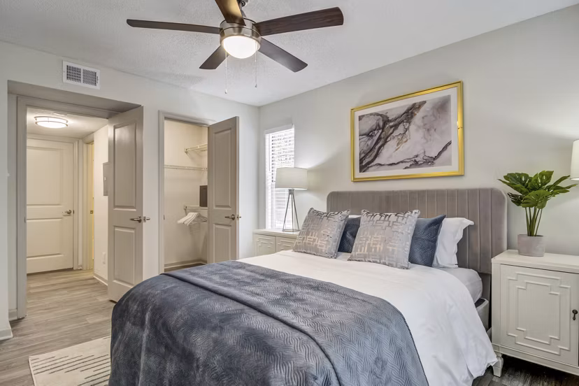 Morgan Place Apartments: Cozy bedroom with modern furnishings and large windows offering natural light