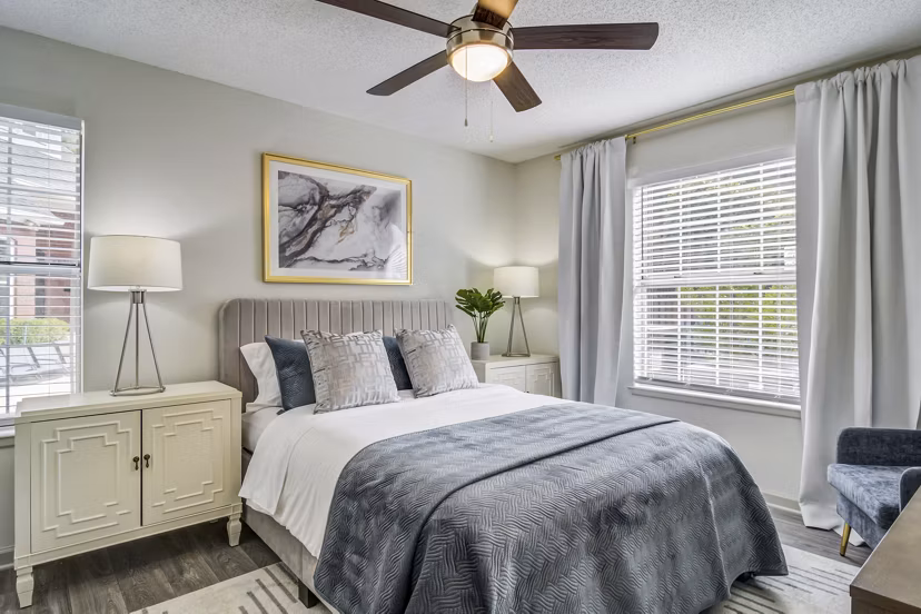 Cozy bedroom with chic decor at Morgan Place Apartments, featuring elegant furnishings and soft lighting for a serene living space