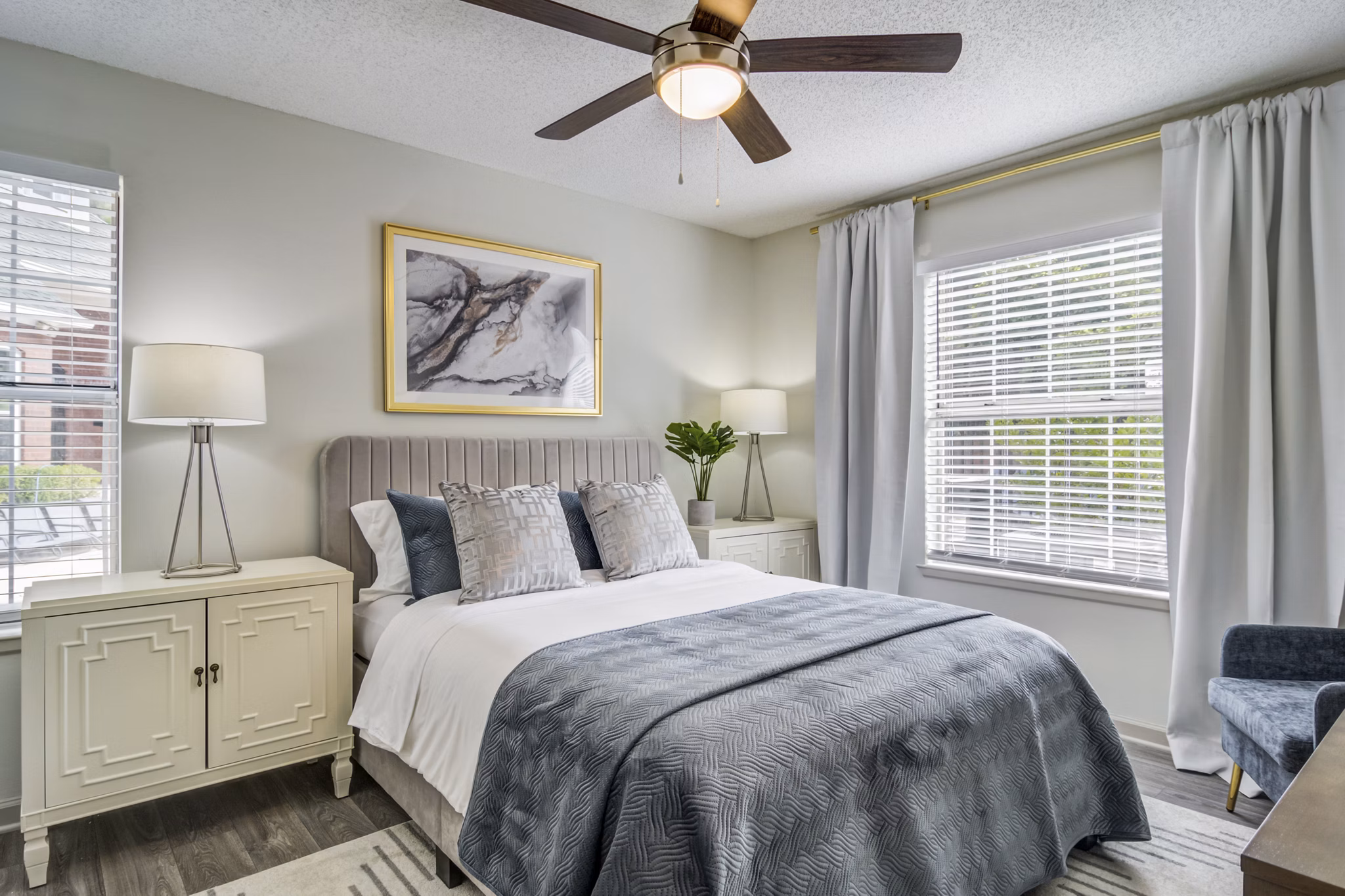 Cozy bedroom with chic decor at Morgan Place Apartments, featuring elegant furnishings and soft lighting for a serene living space