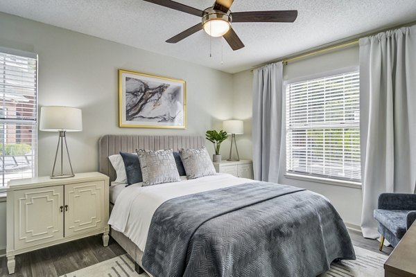 Cozy bedroom with chic decor at Morgan Place Apartments, featuring elegant furnishings and soft lighting for a serene living space