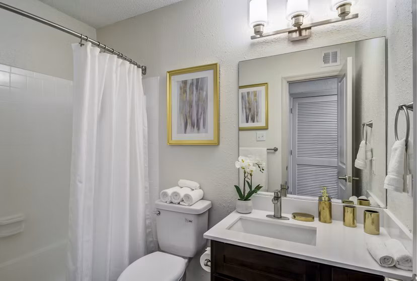 Cozy bedroom with a plush bed and modern decor at Morgan Place Apartments