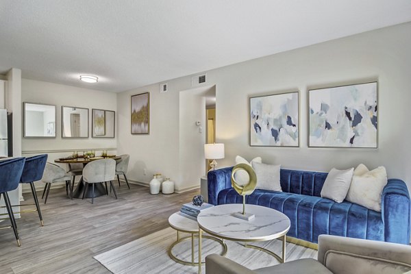 Modern living room with chic furnishings and natural light at Morgan Place Apartments luxury living