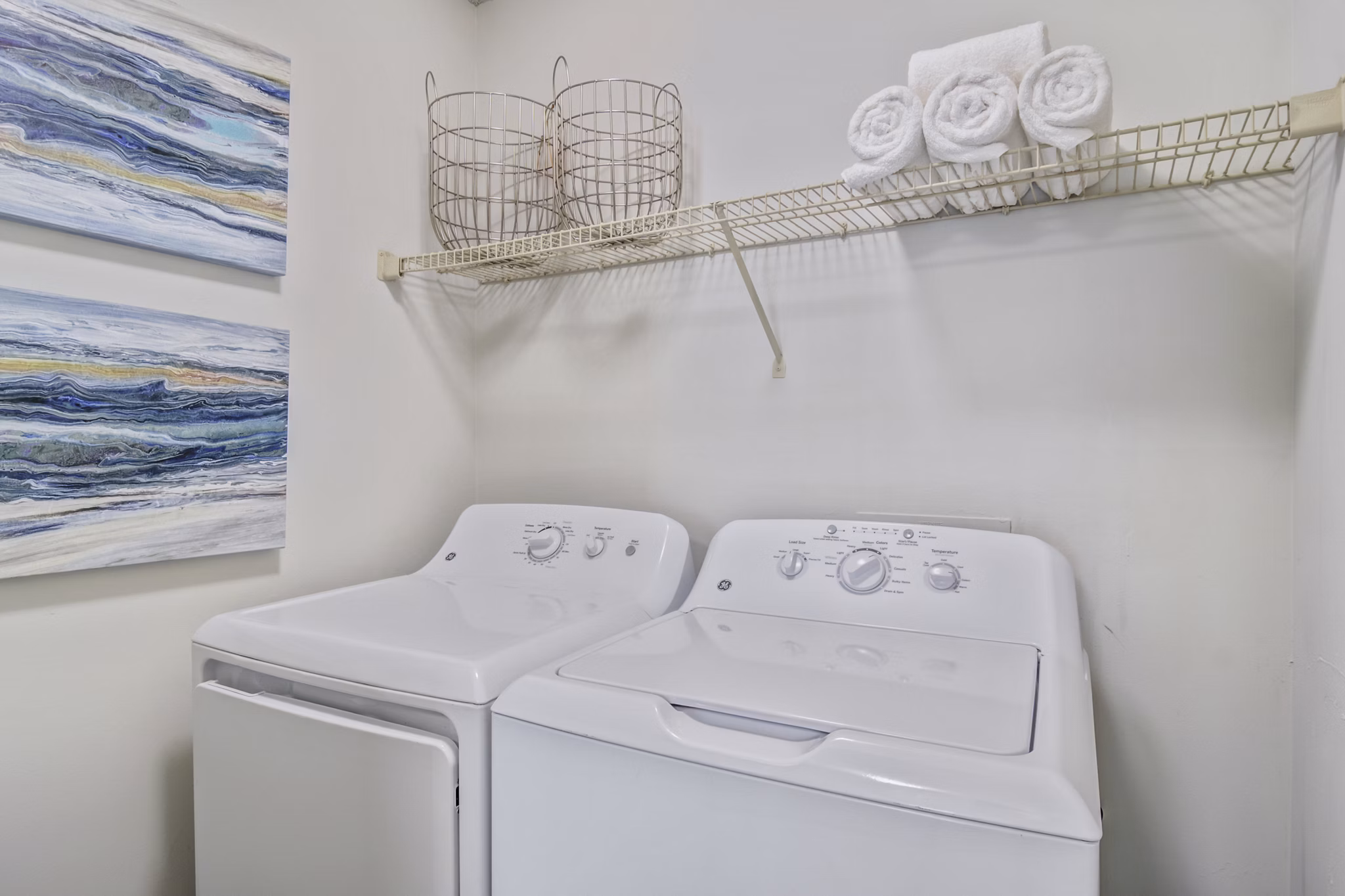 Laundry room with modern machines at Morgan Place Apartments in the Greystar property portfolio
