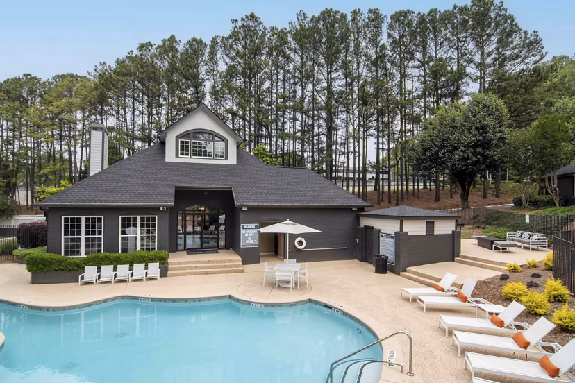 Resort-style pool with lounge chairs at Morgan Place Apartments, offering a luxury outdoor experience for relaxation and recreation