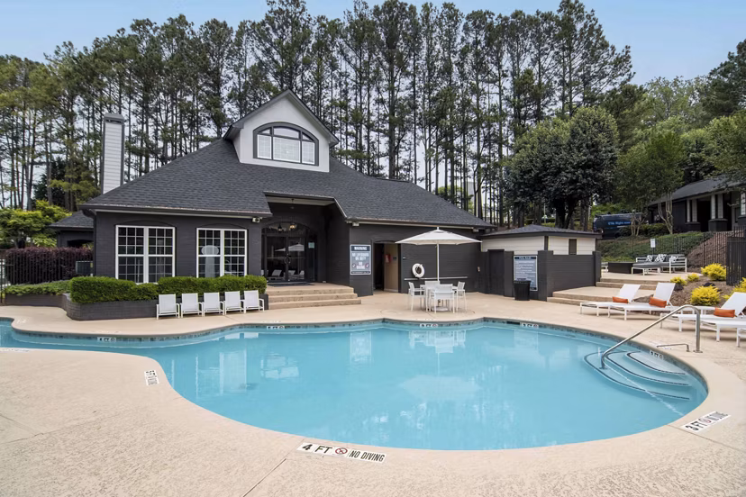 Resort-style pool area at Morgan Place Apartments with luxury loungers and lush landscaping