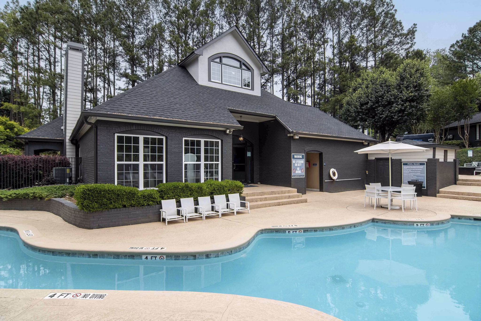 Resort-style pool with lounge seating at Morgan Place Apartments