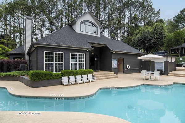 Resort-style pool with lounge seating at Morgan Place Apartments
