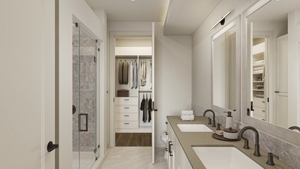 Bathroom featuring sleek fixtures and modern design at The Bouldin Apartments