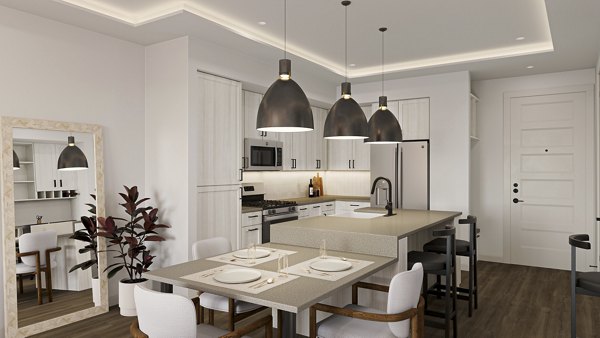 Dining area with modern decor and seating at The Bouldin Apartments, offering luxury living spaces in a vibrant community