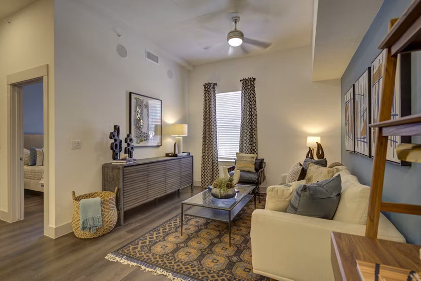 living room at Alexan Rivercrest Apartments 