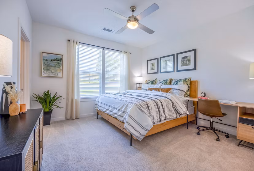 Cozy bedroom with natural light at Napa Oaks Apartments featuring elegant decor and modern furnishings