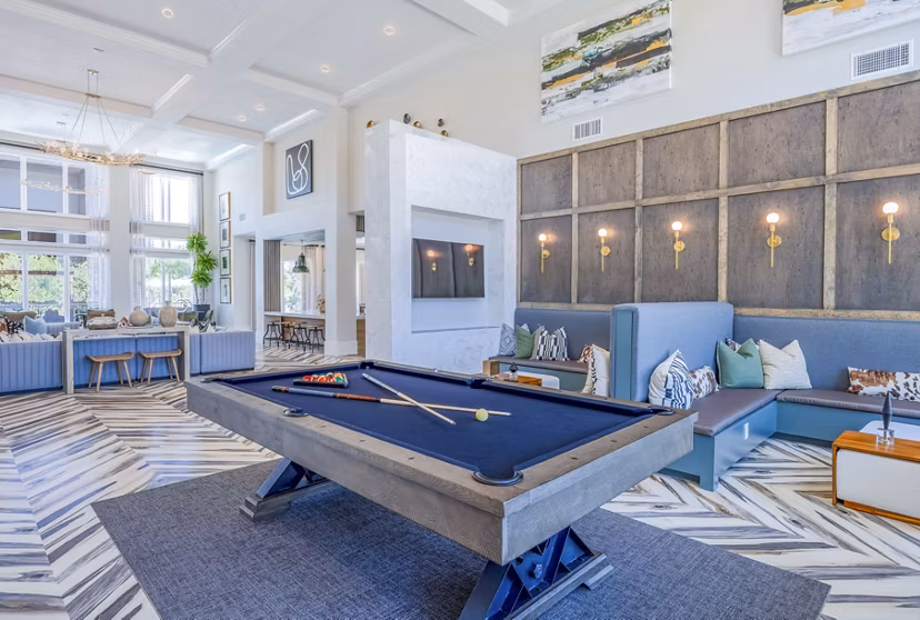 Modern game room with billiards and lounge seating at Napa Oaks Apartments