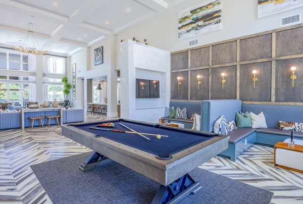 Modern game room with billiards and lounge seating at Napa Oaks Apartments