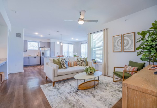 Spacious living room with modern decor at Napa Oaks Apartments, featuring ample natural light and luxury finishes