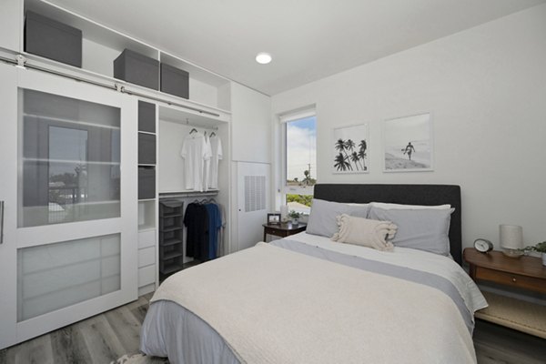 Modern bedroom featuring elegant decor and natural light at 3167 Market Apartments