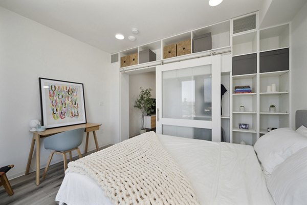 Cozy bedroom with modern decor at 3167 Market Apartments