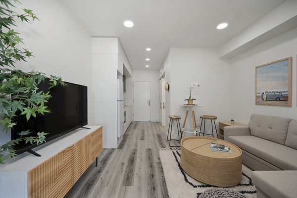 Clubhouse with modern design and cozy seating at 3167 Market Apartments