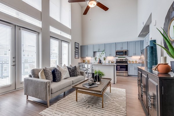 Clubhouse featuring modern design and spacious lounge at The District in Little Elm Apartments